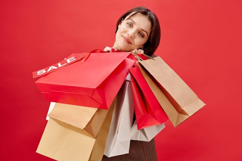 Woman in Short Hair Holding Shopping Bags