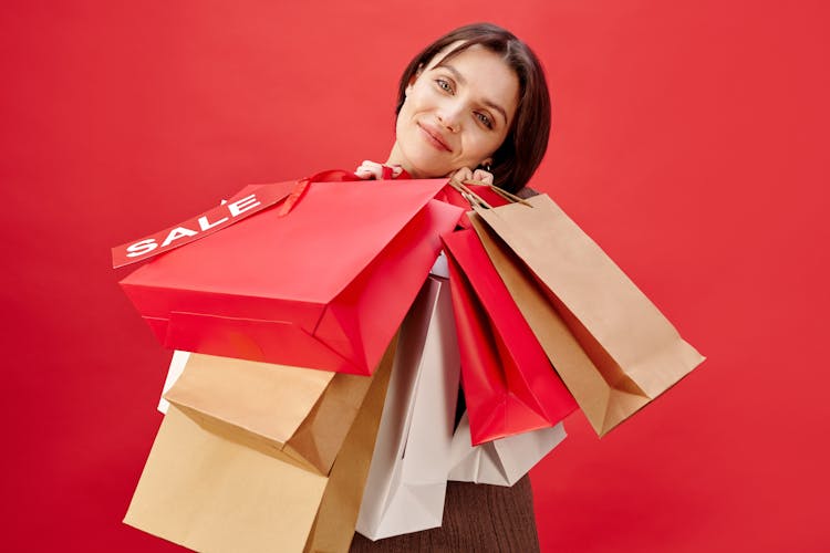 Woman In Short Hair Holding Shopping Bags