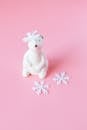 White Bear Ceramic Figurine on Pink Surface