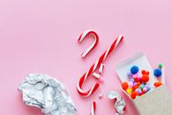 Red and White Candy Cane on White Paper