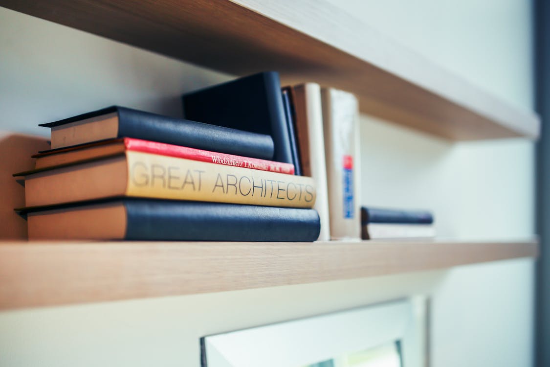 Free Great architects book - wooden shelf Stock Photo