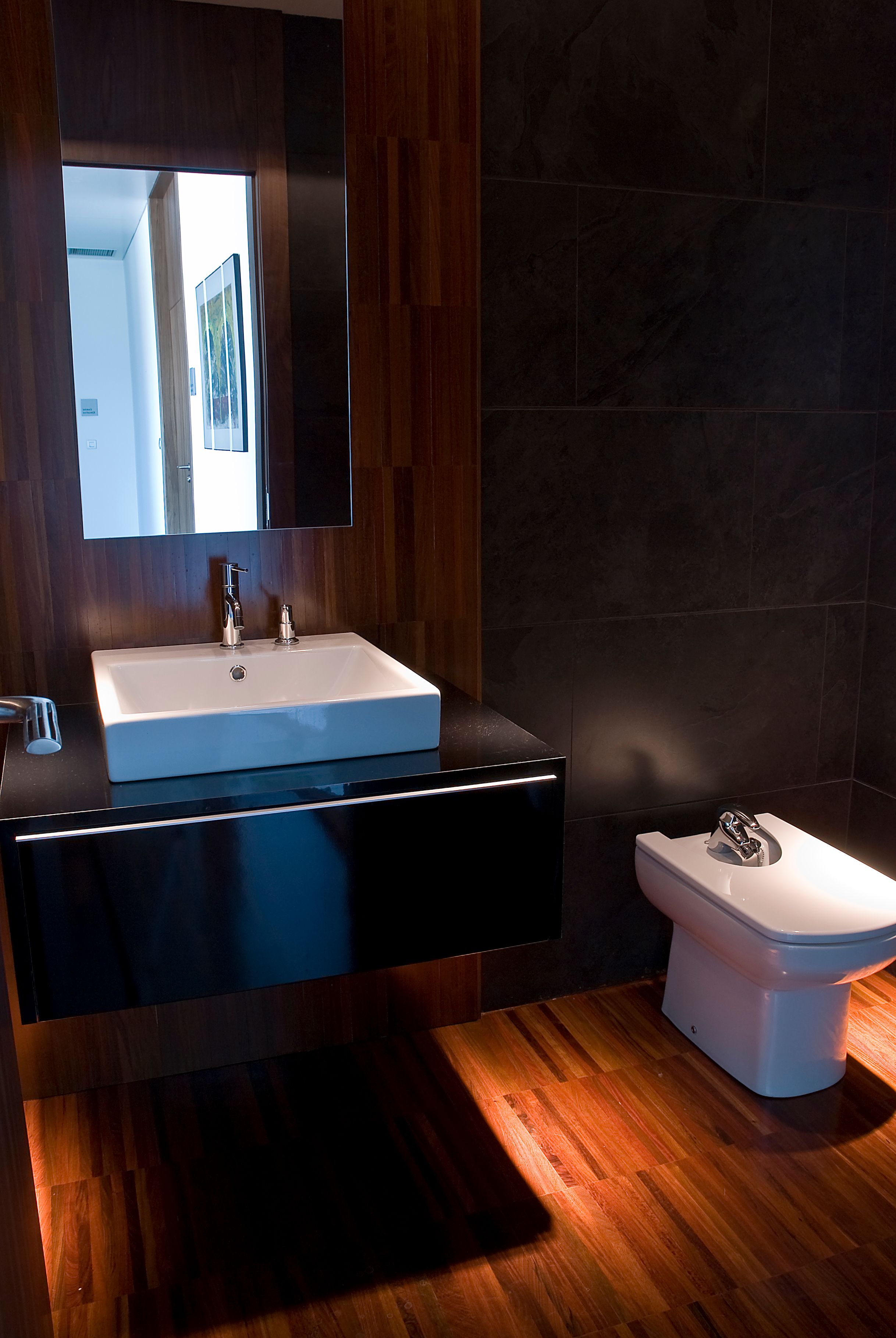 Step-by-step plumbing setup showing a T-valve connector on a UK toilet water supply line