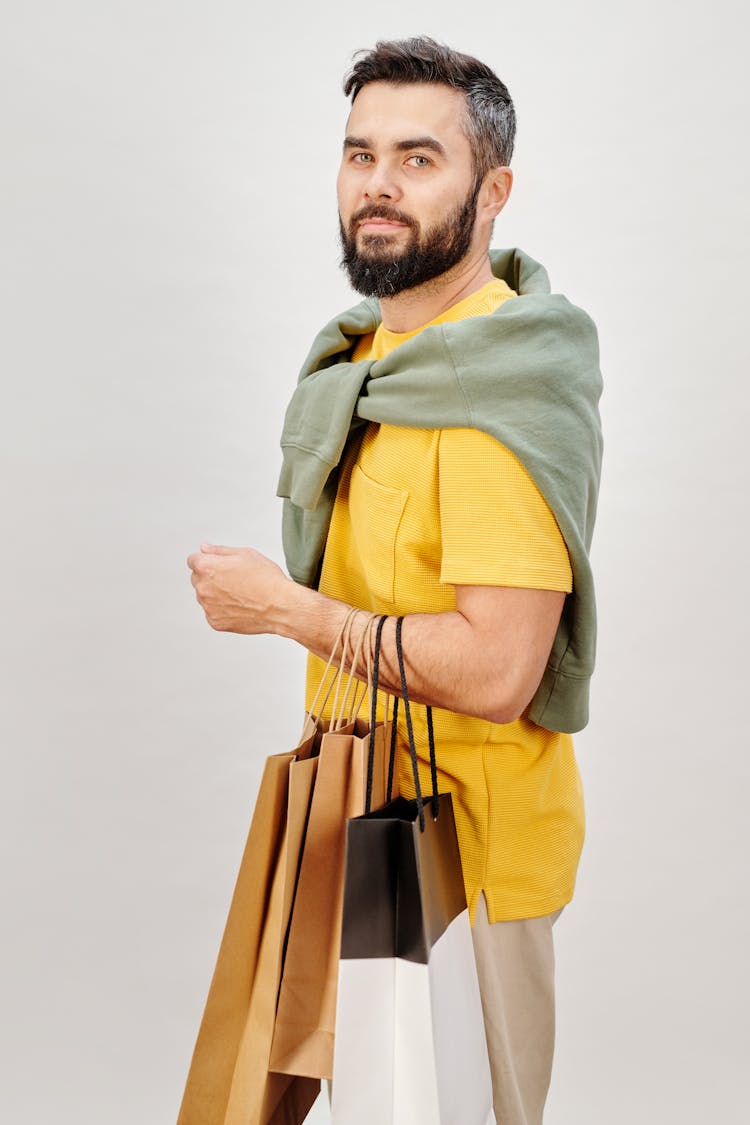 Man Carrying Shopping Bags