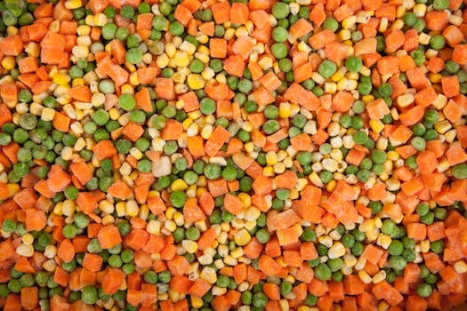 A vibrant mix of frozen carrots, peas, and corn showcasing healthy eating options.