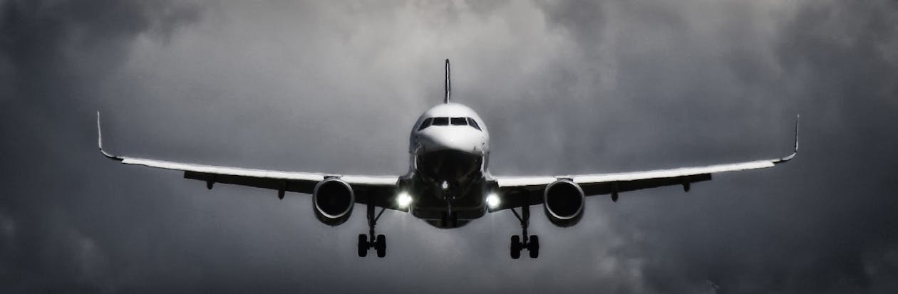 Free In Flight Airliner in Grayscale Photo Stock Photo
