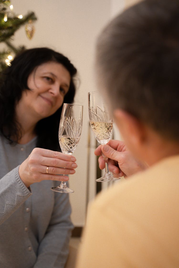 A Couple Clinking Their Glasses