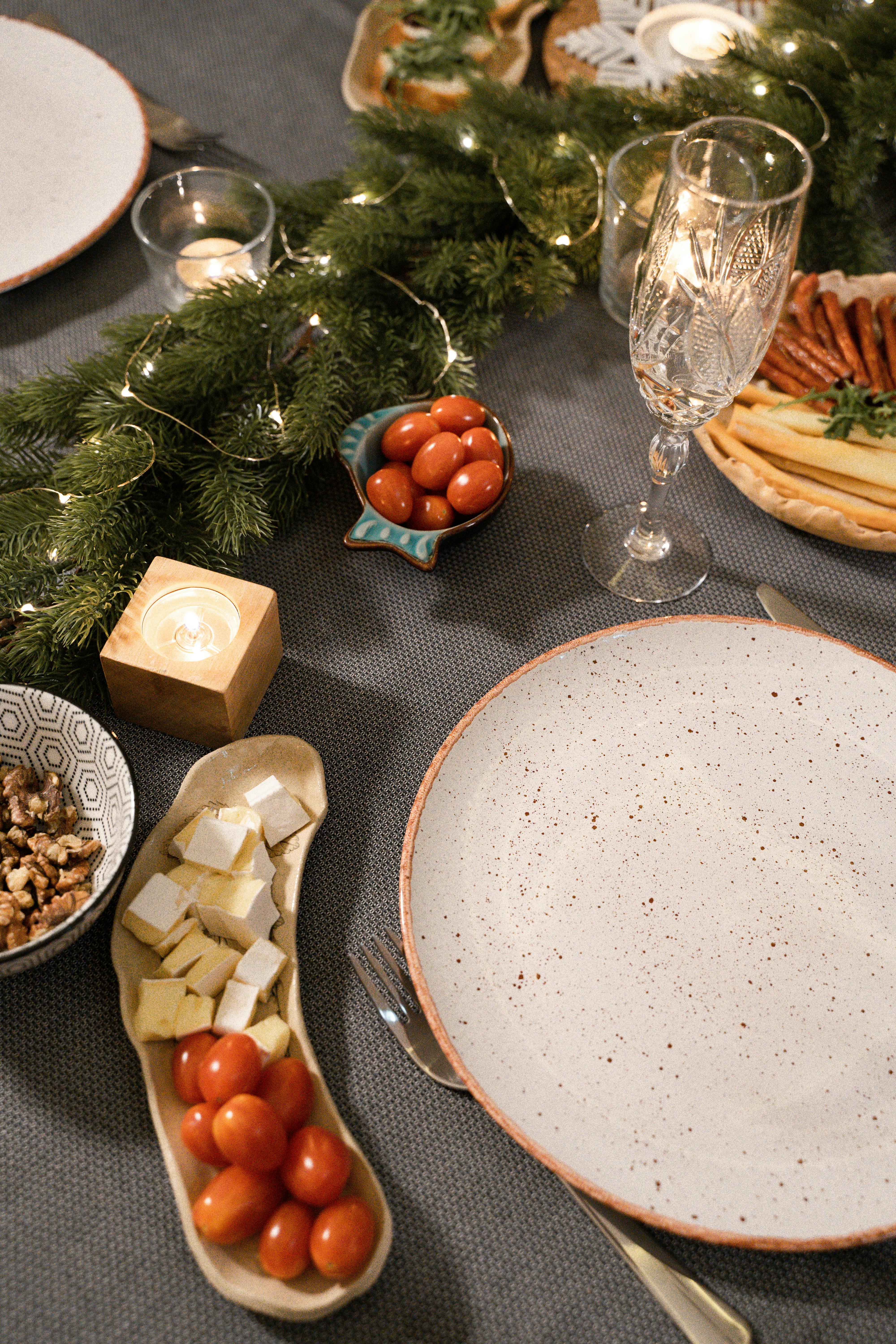 white and brown round ceramic plate on brown wooden table