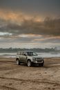 Motor Vehicle Parked on the Sand