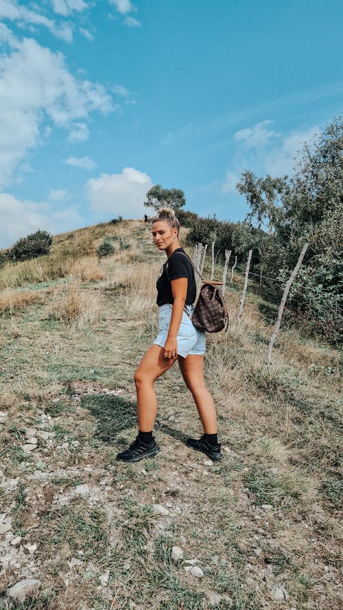 A Woman Walking on the Field