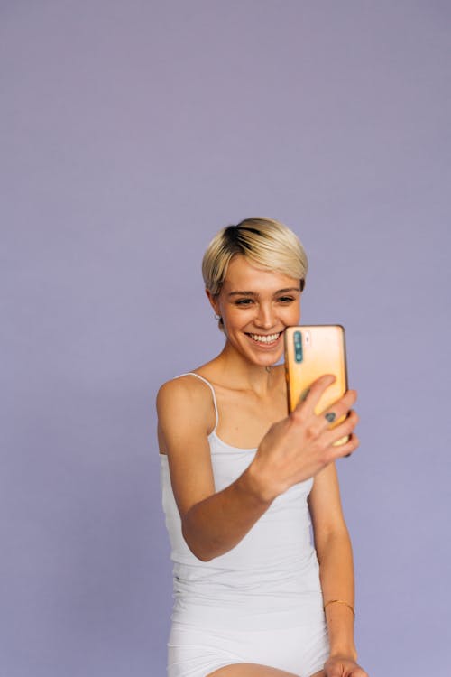 Free Woman in White Sleeveless Top Taking Selfie Stock Photo