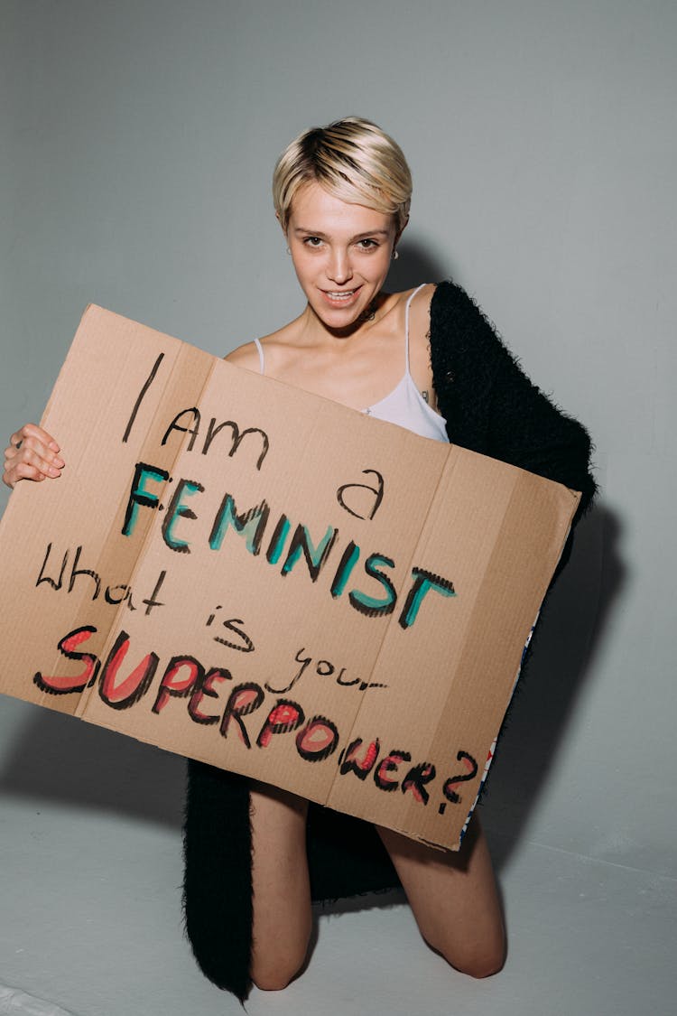 Woman Holding Brown Cardboard Placard