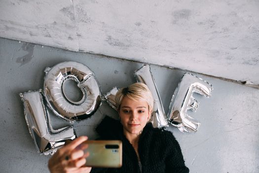 A Woman Doing Selfie using a Smartphone