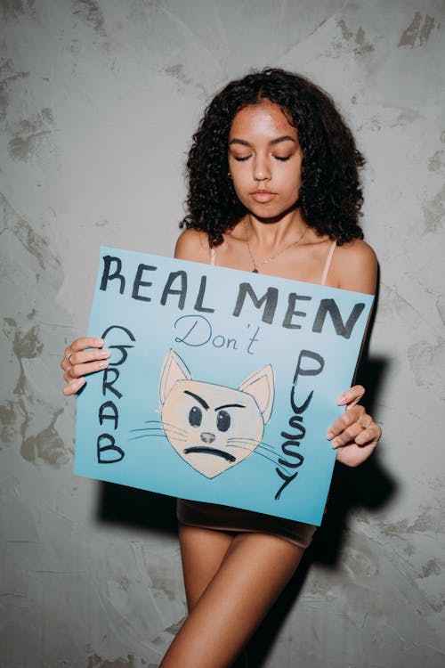 A Woman Holding a Blue Poster Slogan