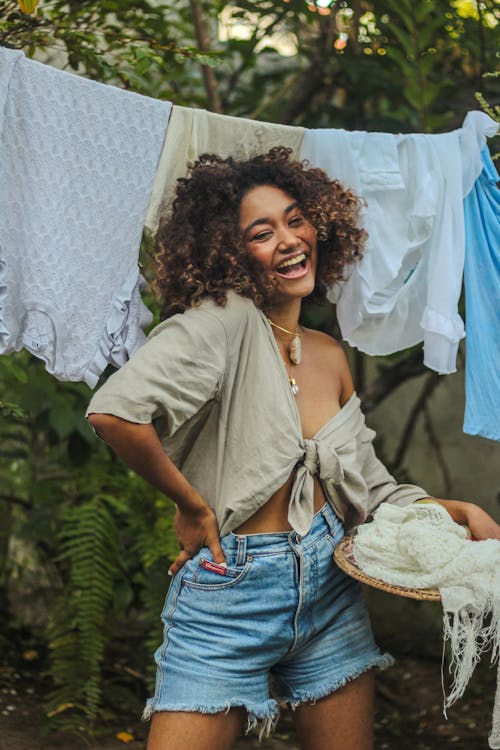 A Woman Smiling with Curly Hair