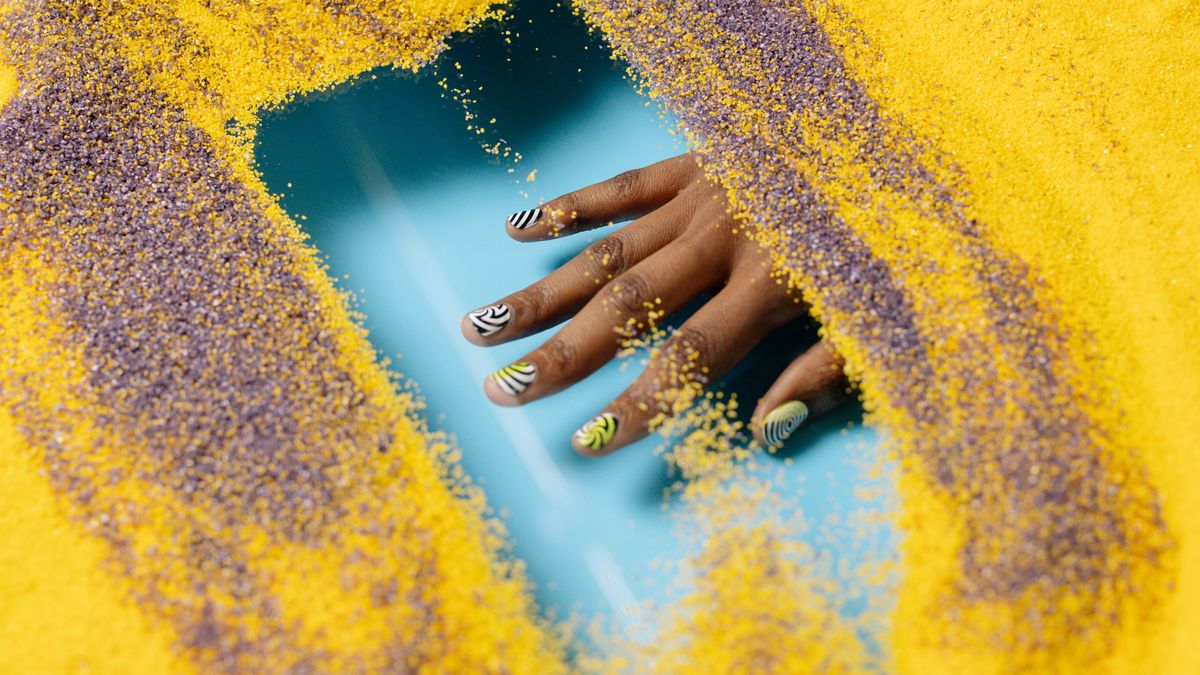 creative dotted flower nail art created at home with a bobby pin