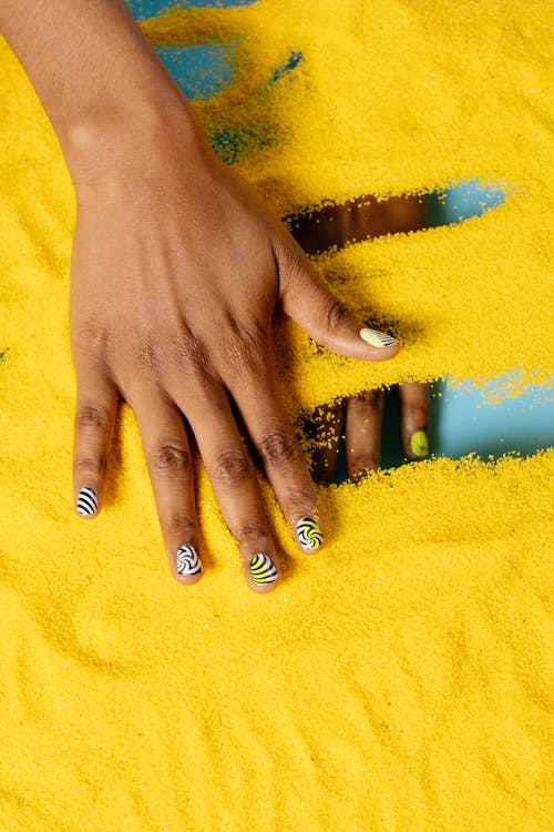 Close-Up Shot of Hands with Nail Polish