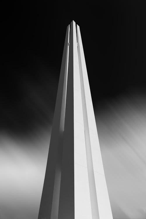 Grayscale Photo of a Concrete Monument