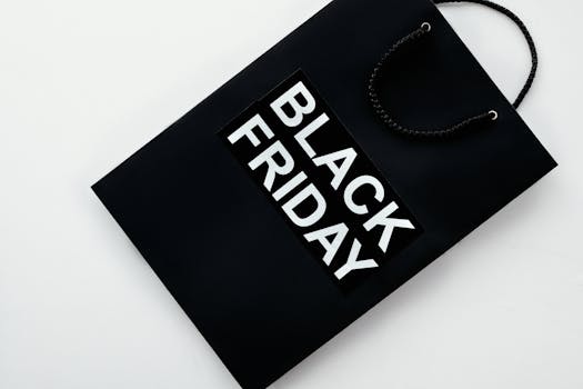 Black Friday shopping bag on a plain background for retail sales and discounts advertising.
