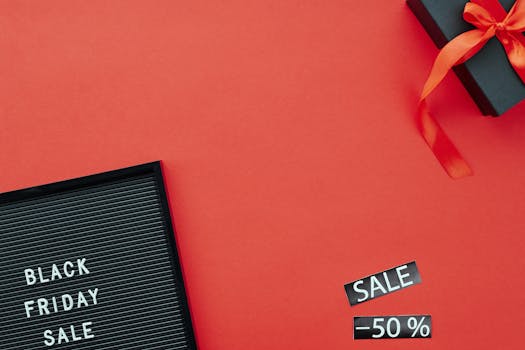 Red background featuring a Black Friday sale sign and gift box, ideal for promoting sales events.