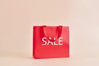Red Paper Bag With Sale Sign