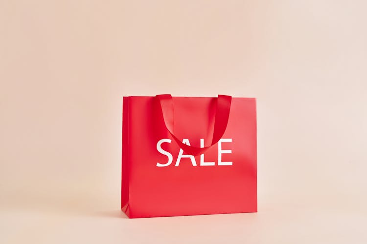 Red Paper Bag With Sale Sign