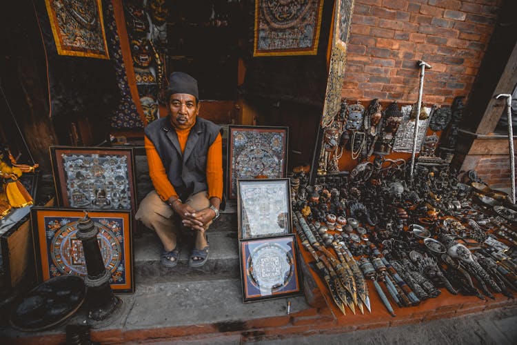 Senior Asian Man Seller In Street Oriental Souvenir Shop