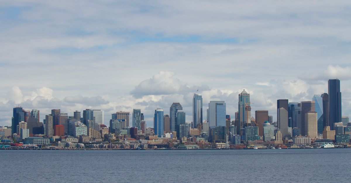 Scenic view of Seattle's iconic skyline with prominent skyscrapers and waterfront.