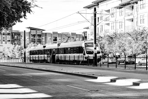Grayscale Photo of a Tram in the Tramway