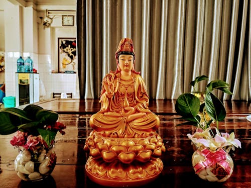 Free Close-Up Shot of a Buddha Figurine  Stock Photo