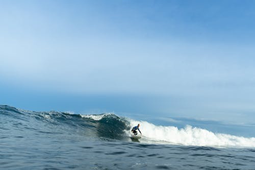 A Person Surfing on the Sea