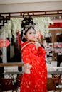 A Pretty Woman in Red Traditional Dress