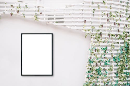 Free Black Picture Frame on White Wall Stock Photo