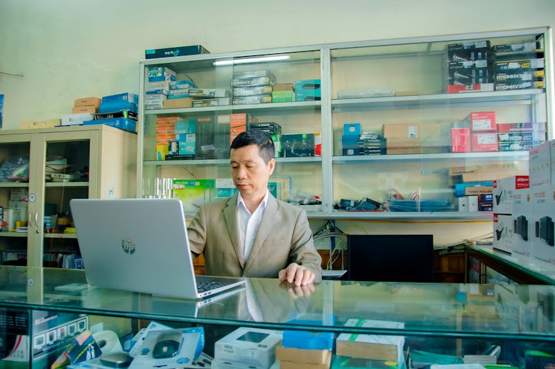 Flat lay of Scrabble tiles spelling the word 'Look' on a white background.