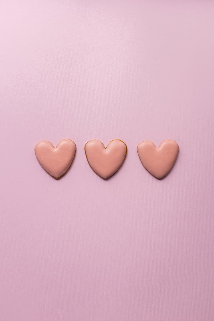 Small Heart Cookies On Pink Surface