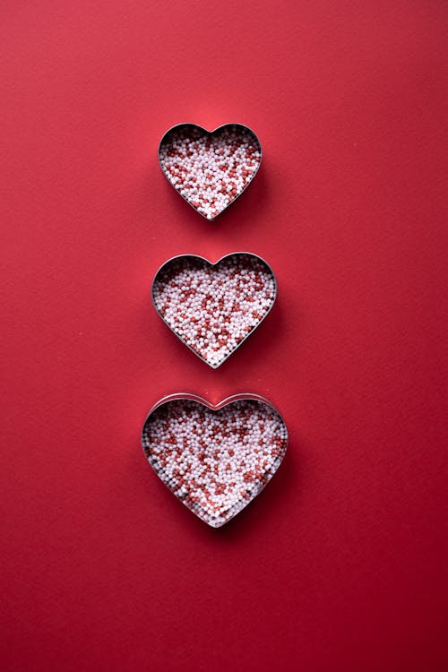 Free Sprinkling in hearts for Valentine day on surface Stock Photo