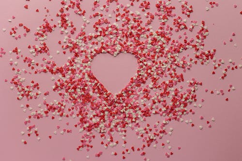 Free Confetti with heart shape on surface Stock Photo