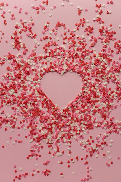 Bunch of cut out of pink and red paper hearts on pink background Stock  Photo by ©AlexeyRyumin 337288618