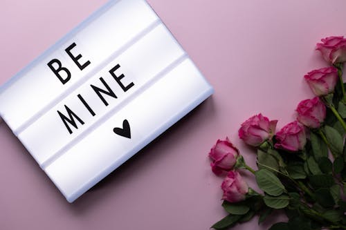 Free Be Mine inscription with bunch of roses Stock Photo