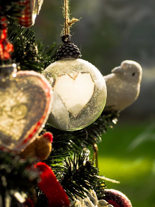 White and Red Baubles on Green Christmas Tree