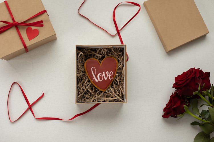 Gift Boxes With Heart Shaped Cookie And Flowers