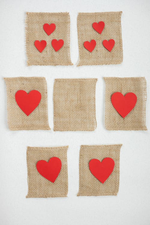 Red paper hearts on burlap parts