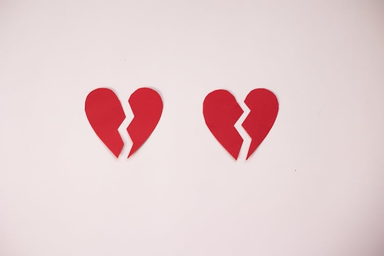 Broken Paper Hearts On White Background