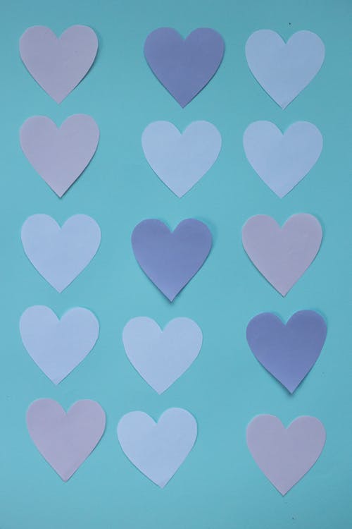 Free Set of paper hearts on table Stock Photo