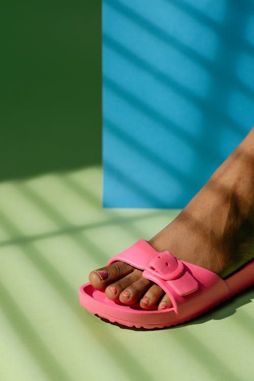 Close-Up Shot of a Person Wearing a Pink Sandal