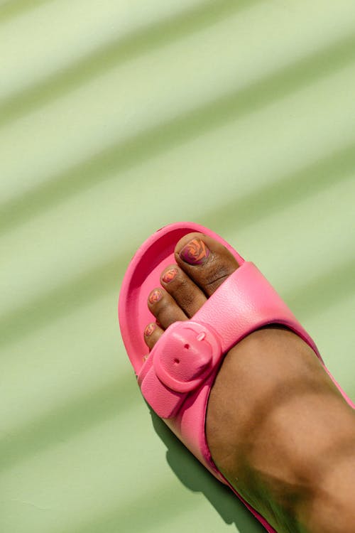 Close-Up Shot of a Person Wearing a Pink Sandal