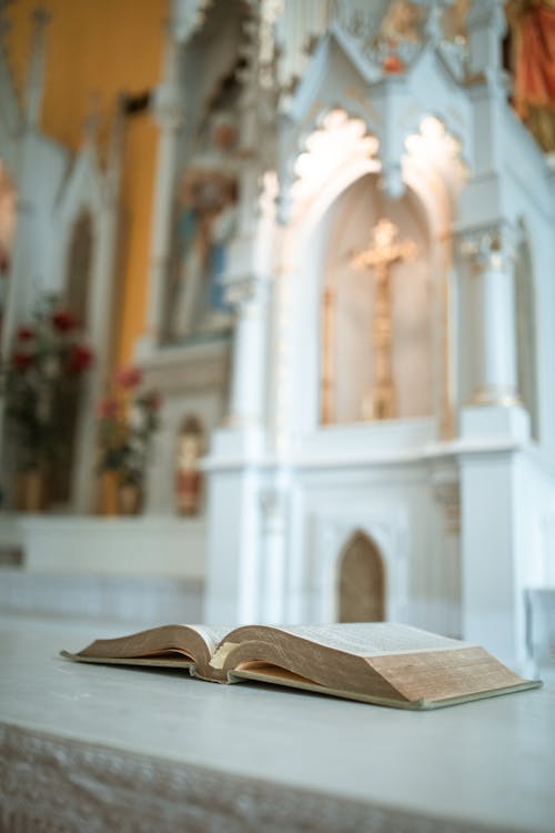 Free Close-Up Shot of a Bible in the Altar Stock Photo