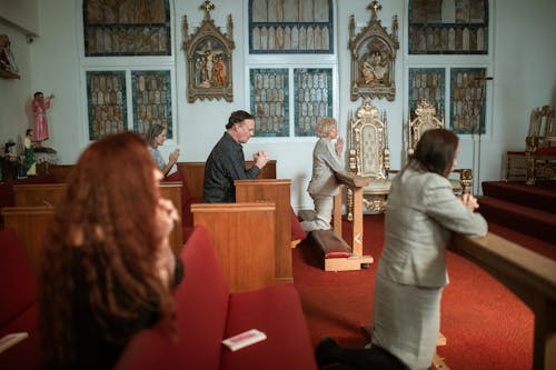Free People Praying inside the Church Stock Photo