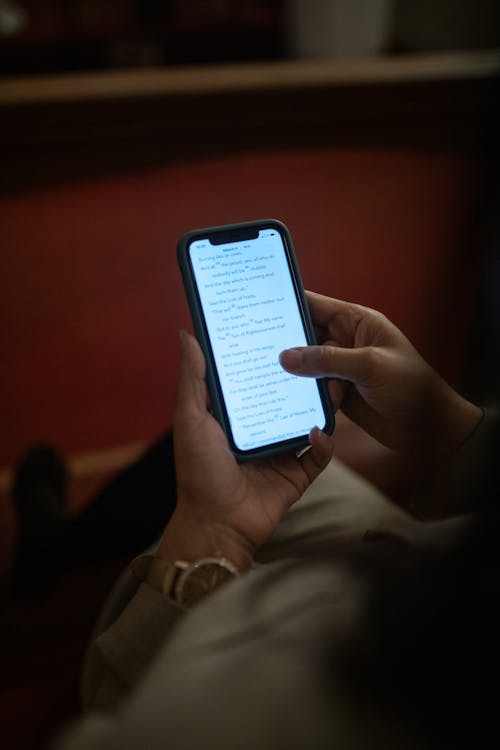 Close-Up Shot of a Person Using a Mobile Phone