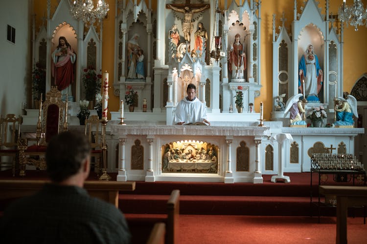 People Sitting On The Church Pews