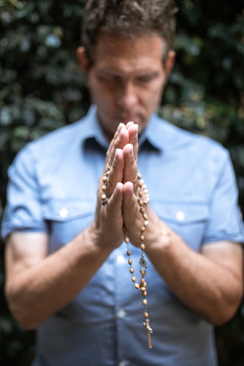 Free A Man Holding Prayer Beads Stock Photo